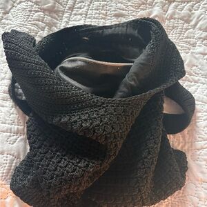 Nice, black knitted bag with strap.